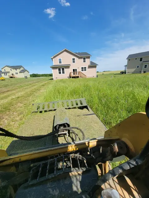Bush hogging an overgrown field in Charlotte NC